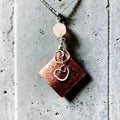 Copper Scroll and Rose Quartz Pendant