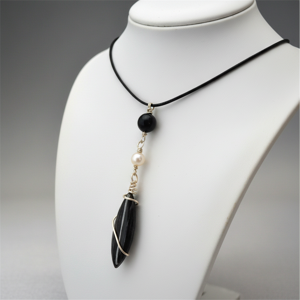 Black stone pendant on jewelry bust