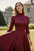 Malachite necklace on model in red dress