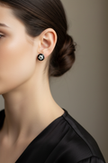 Onyx and diamond stud earrings on model - realistic small size