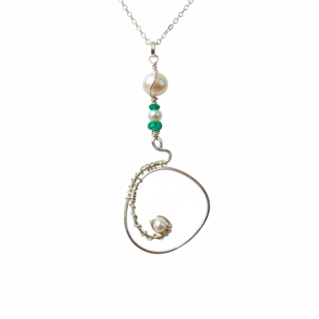 Pearl and emerald spiral pendant close-up detail